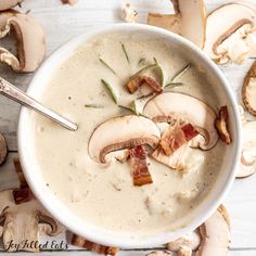 a white bowl filled with mushroom soup and bacon