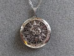 "Size of the locket:  (1 and 1/2)\" in diameter Please choose the chain length from the drop down menu.  If you would like shorter/longer than those, please leave a note for me.  I will adjust it for you. Thank you for looking. Comes in a silver gift box" Moon Locket Necklace, Locket Necklace Aesthetic, Sun Locket, Sun And Moon Jewelry, Moon Constellation, Silver Locket Necklace, Fantasy Gifts, Silver Gift Box, Celestial Jewelry