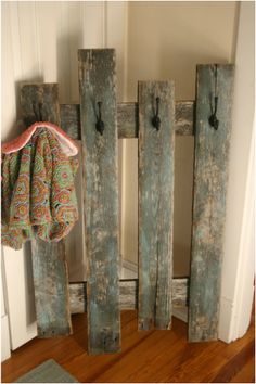 a coat rack made out of old wooden boards