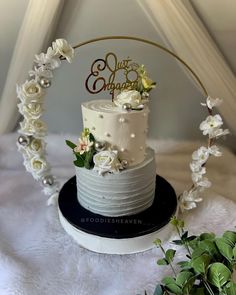 a wedding cake with white flowers on top