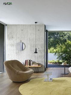 a living room filled with furniture and a large window