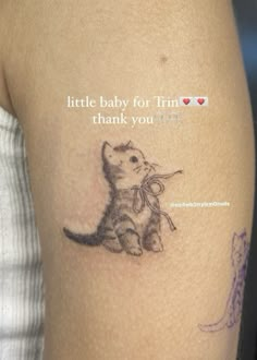 a woman with a tattoo on her arm that says, little baby for tim thank you