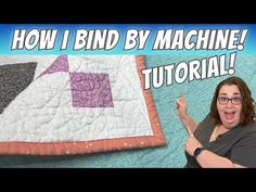 a woman pointing at a quilt with the words how i bind by machine