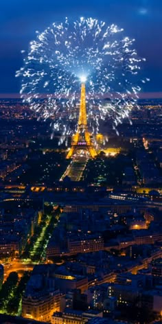 the eiffel tower is lit up with fireworks