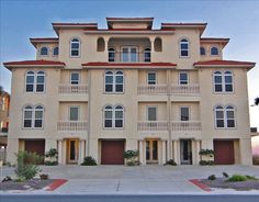 an apartment building with multiple windows and balconies