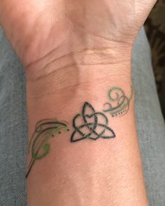 a person with a tattoo on their wrist