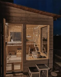 the inside of a small wooden house at night