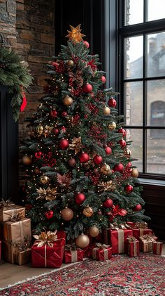 a christmas tree with presents under it in front of a large window and a fireplace