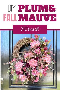 a wreath with pink flowers on the front door