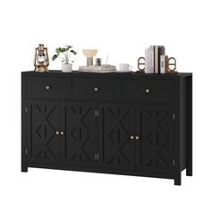 the sideboard is black and has gold accents on it, along with other items