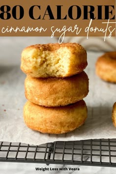 three sugar donuts stacked on top of each other with the words, 30 calorie cinnamon sugar donuts