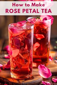 two glasses filled with rose petal tea on top of a wooden table