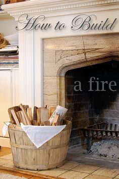 a fire place with a bucket full of wood and a sign that says how to build a fireplace