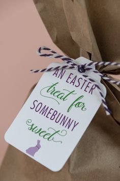 a brown paper bag with a tag that says an easter treat for somebunny sweet