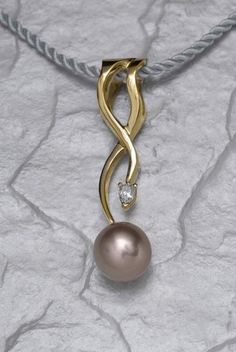 This stunning Nouveau Salon design is titled "In a Dream." It contains a gorgeous 11+mm mauve/lavender freshwater pearl with a 1/4carat pear shape diamond accent. This flowing organic design has a wide opening at the top that will accommodate large Omega type chains.Unique pearls like this are very hard to find and are personally hand selected for their rare color and size. I have made this with Golden South Sea pearls and other color large Freshwater. If the design appeals to you and a differen Silk Cord Necklace, Pearl Diamond Pendant, Silver Pearl Ring, Custom Pendant, Golden South Sea Pearls, Tahitian Black Pearls, Custom Pendants, Dream It, Organic Design