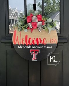 a welcome sign on the front door of a house