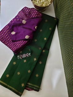 Dark green kancheepuram silk saree completely handwoven with pure zari motifs on the saree, and a deep violet pallu in contrast. The blouse is plain violet silk Plain Dark Green Saree Contrast Blouse, Dark Green Saree Contrast Blouse, Green Saree Contrast Blouse, Dark Green Saree, Saree Contrast Blouse, Green Kanchipuram Silk Saree, Kancheepuram Silk Saree, Bottle Green Saree, Cotton Blouse Design