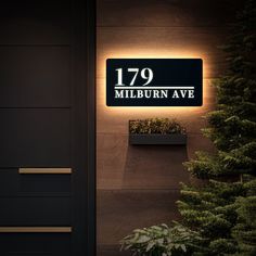 an illuminated sign on the side of a building that reads'79 millburn avenue '