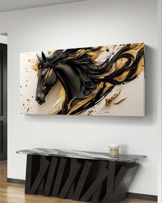 a black and gold horse painting hanging on the wall