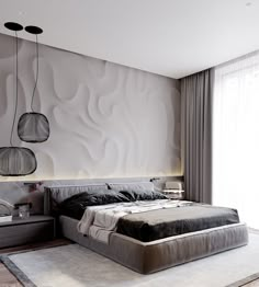 a large bed sitting in a bedroom next to two lamps on the side of a wall