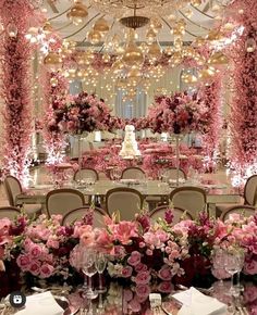 a table set up with pink flowers and candles for an elegant wedding reception at the four seasons hotel