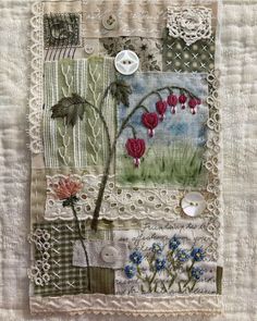 a patchwork quilt with buttons and flowers on it