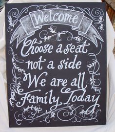 a chalkboard sign that says, welcome to those at seat not a side we are all family today