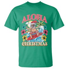 a green shirt that says aloha christmas with an image of a surfer riding a wave