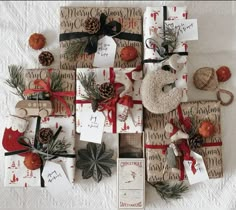 christmas presents wrapped in brown paper and tied with red ribbon, pine cones, twine firs, and other holiday decorations