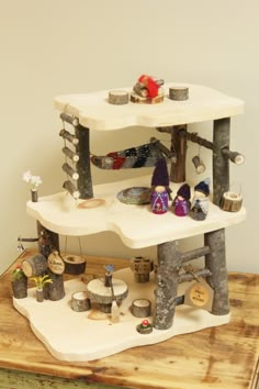 a wooden table topped with two tiered shelves