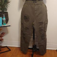 Army Green Plus Size Cargo Distress Jogger Denim Jeans With 1 1/2 Inch Waistline And Belt Hoops Belt Do Not Come With Pant, Zipper And Snap, Side Pockets And Large Size Pocket With Flaps Size 2x Fabric Is Non Stretchable Inner Seam 28 In. Outer Seam 39 In. These On Trend Joggers Can Be Paired With Sneakers Or Boot You Can Dress It Up Or Down Pair With Your Favorite Army Fatigue T-Shirt Or Tank Top And The Sneaker Or Boots Of Your Choice Ripped Denim Overalls, Plus Size Cargo, Blue Jean Overalls, Distressed Overalls, Army Fatigue, Forever 21 Plus Size, Ribbed Flares, Denim Overalls Shorts, Black Overalls