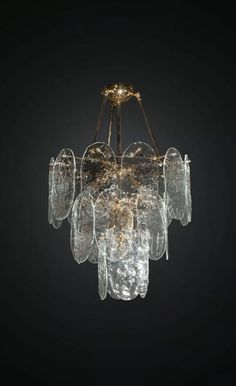 a glass chandelier hanging from the ceiling