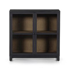 the black and oak bookcase has three glass doors on one side, and two shelves with