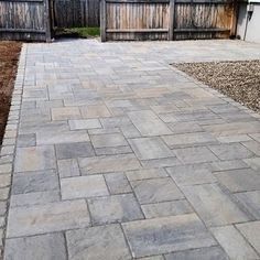 a brick walkway in front of a house