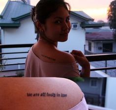 a woman with a tattoo saying we are all looking in love