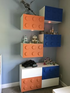 an image of a room with legos on the wall and shelves above it that are made out of lego blocks