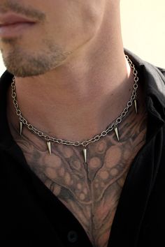 100% stainless steel cable chain adorned with hanging spikes. Fits any alternative, goth, or e-boy/e-girl aesthetic. Made for the long run, this necklace will last long enough to pass down and most importantly, never turn your skin green. 6mm x 19in. + 3in. adjustable Male Accessories Necklace, Gothic Jewelry With Spikes For Alternative Fashion, Alternative Fashion Silver Spiked Jewelry, Silver Spiked Jewelry For Alternative Fashion, Alternative Fashion Jewelry With Adjustable Chain, Edgy Aesthetic Grunge, Male Accessories, Streetwear Jewelry, Goth Necklace