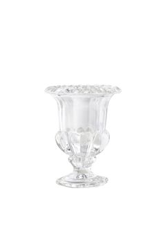 a clear glass vase sitting on top of a table