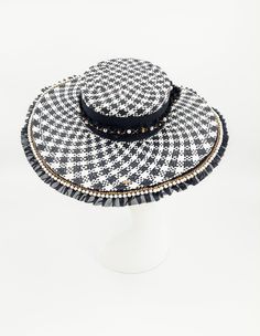 Timeless and classic black and white checkerboard hat. Accented with gold and pearls. Handmade and one of kind. 58cm with adjustable band. Comes with a hat box.