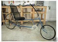 a blue bicycle parked inside of a garage