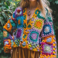 a woman wearing a colorful crochet jacket