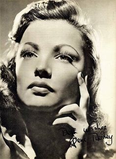 an old black and white photo of a woman with her hand on her face, looking off to the side