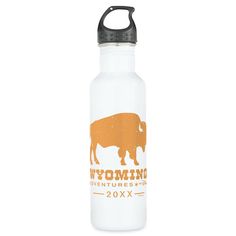 a white water bottle with an orange and black logo on the side that says wyoming adventures