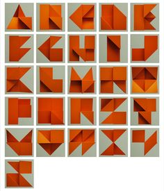 many orange origami pieces are arranged in squares and rectangles on a gray background