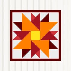 an orange and red star quilt on a white striped wall with vertical lines in the background