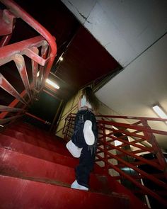 a person walking up some stairs in a building