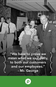 a man and two children are standing in front of a sign that says, we have to prove we mean what we say daily