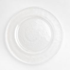 an empty white plate on a white surface