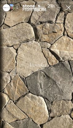 the stone wall is made up of several different types of rocks, and it looks like they