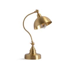 an antique brass desk lamp on a white background with the light turned on and off